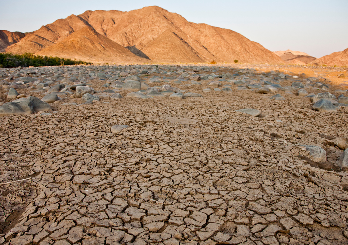 Cracked Ground and a Mountain in the Desert Area 